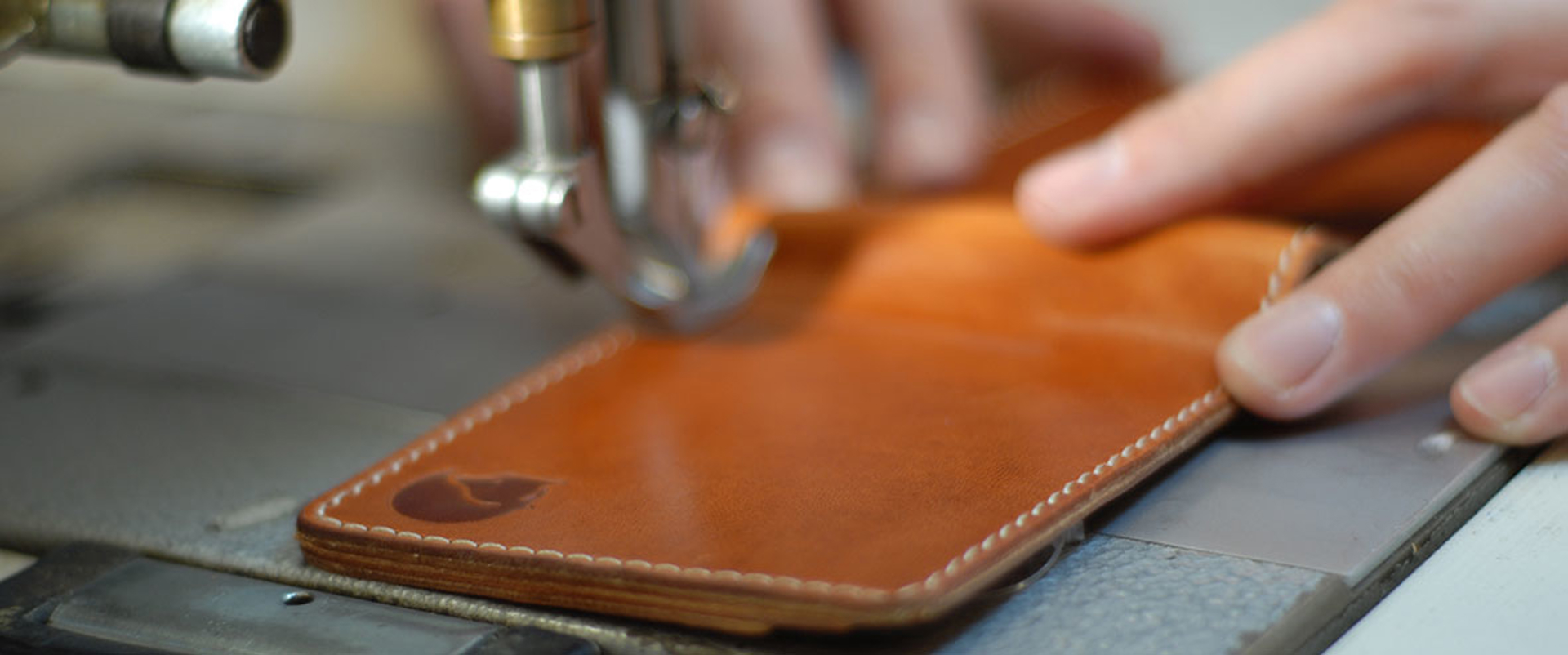 Leather watch being stitched